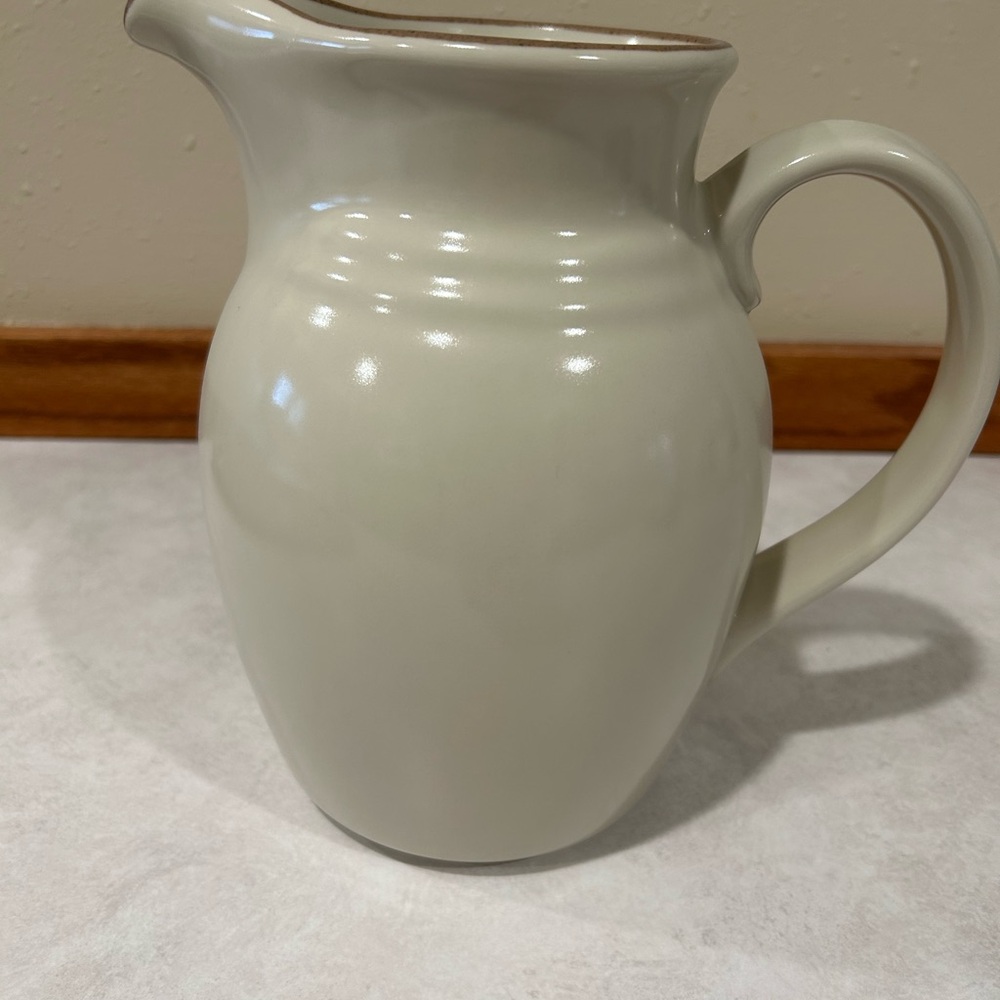Noritake Cream Ceramic Pitcher with Brown Rim